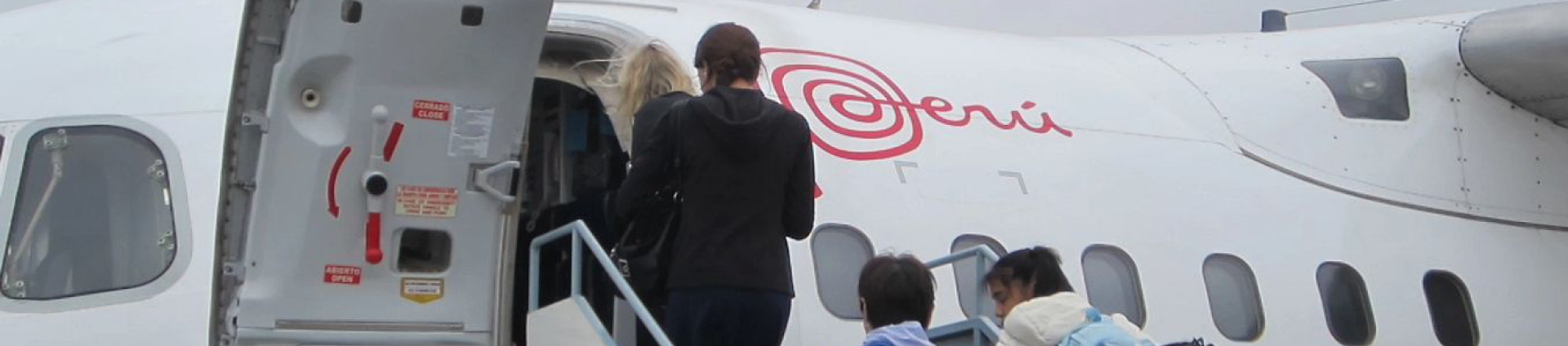 People getting on a plane